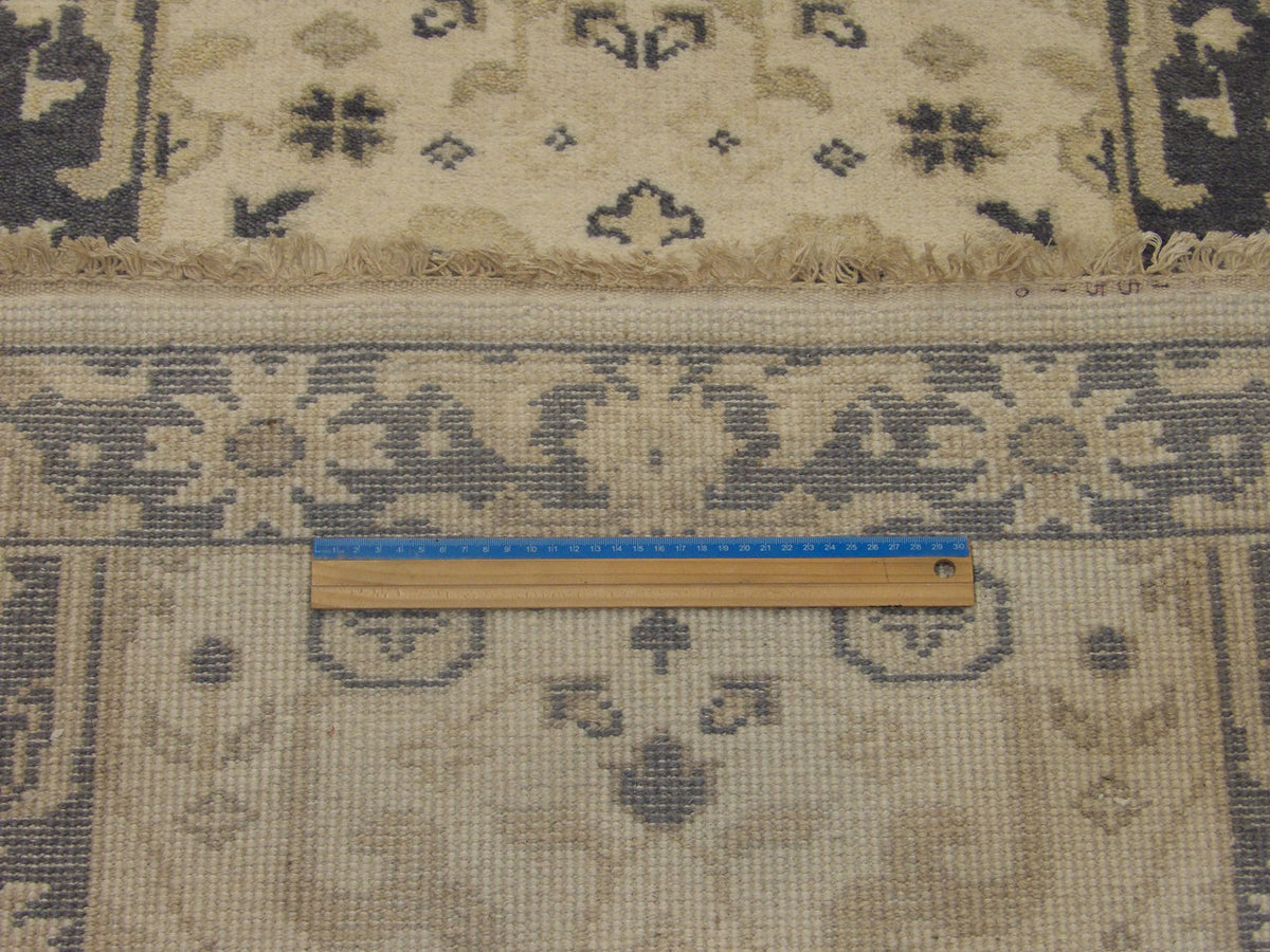 Gray and ivory Oushak runner in hallway setting