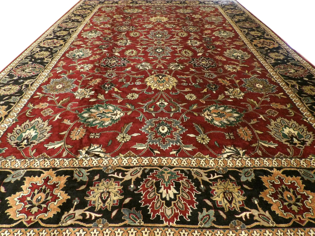 Close-up of wool pile, antique black and red rug