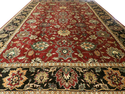 Close-up of wool pile, antique black and red rug