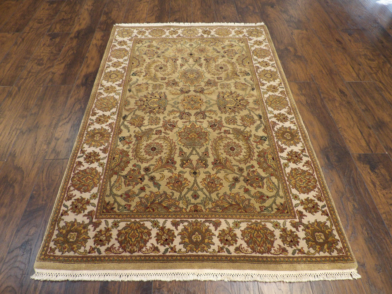 Close-up of antique wash wool pile, gold rug