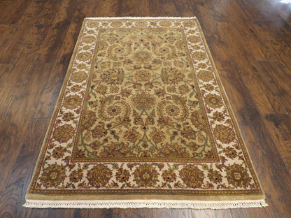 Close-up of antique wash wool pile, gold rug