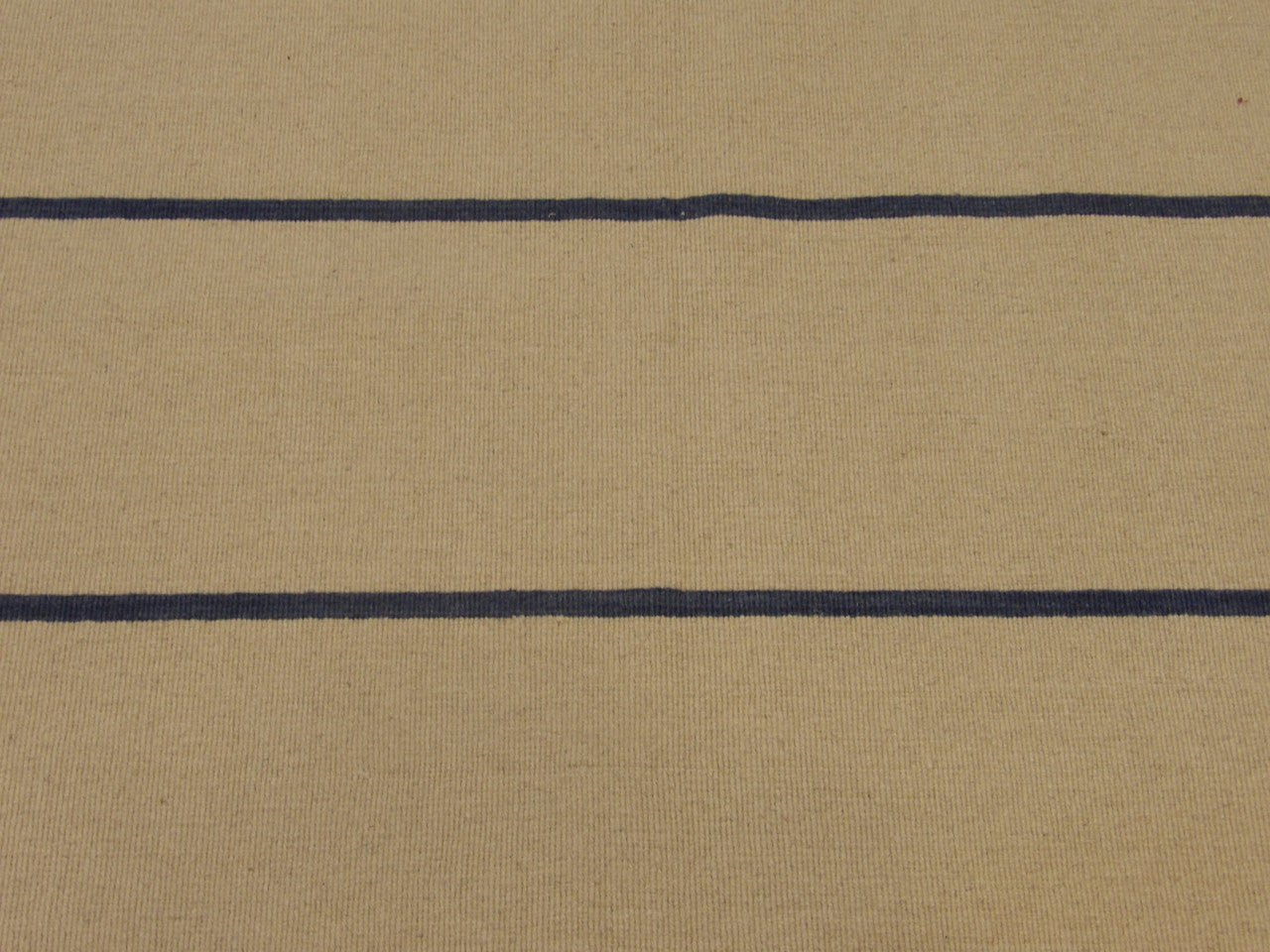 Coastal rug edge detail, blue and ivory