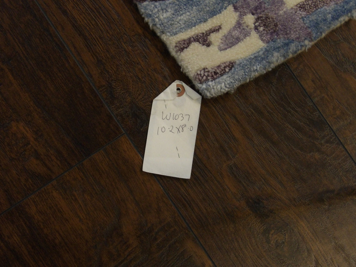 Full room view of transitional abstract carved hand-knotted rug