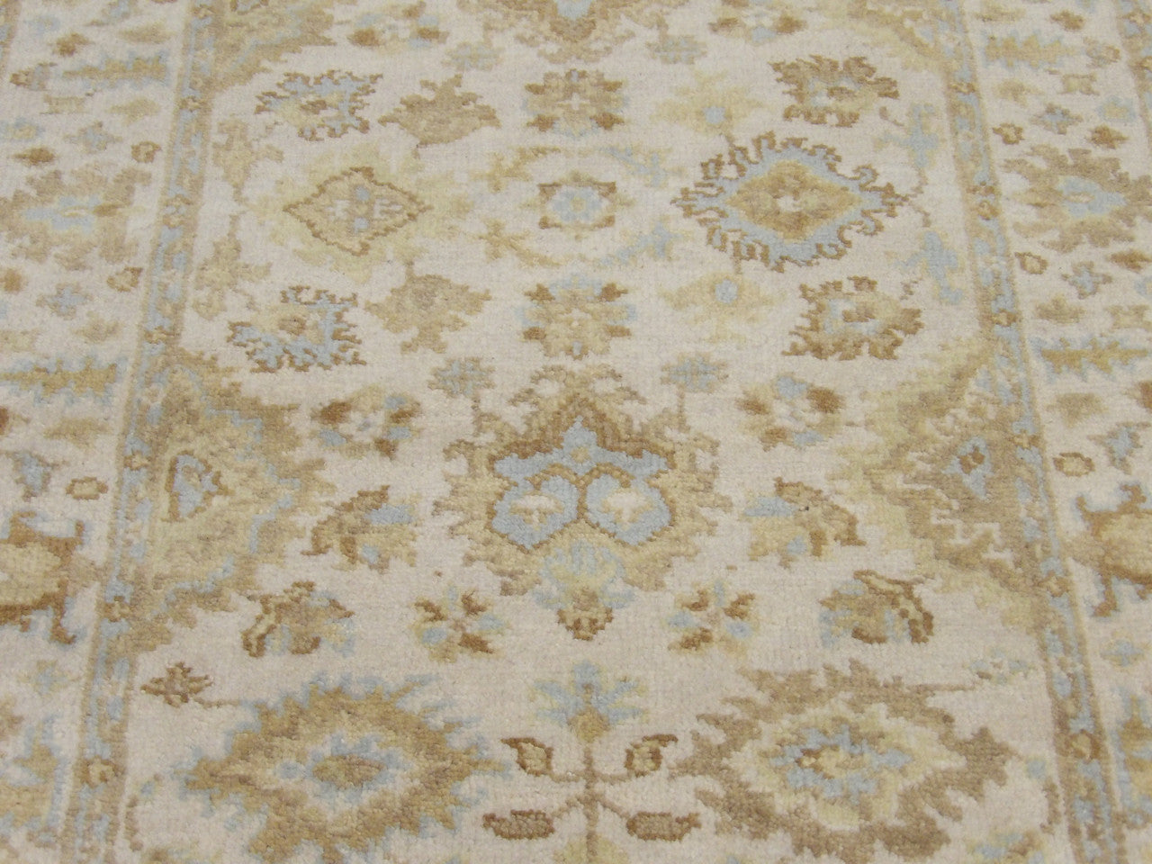 Back of Oushak hand-knotted rug