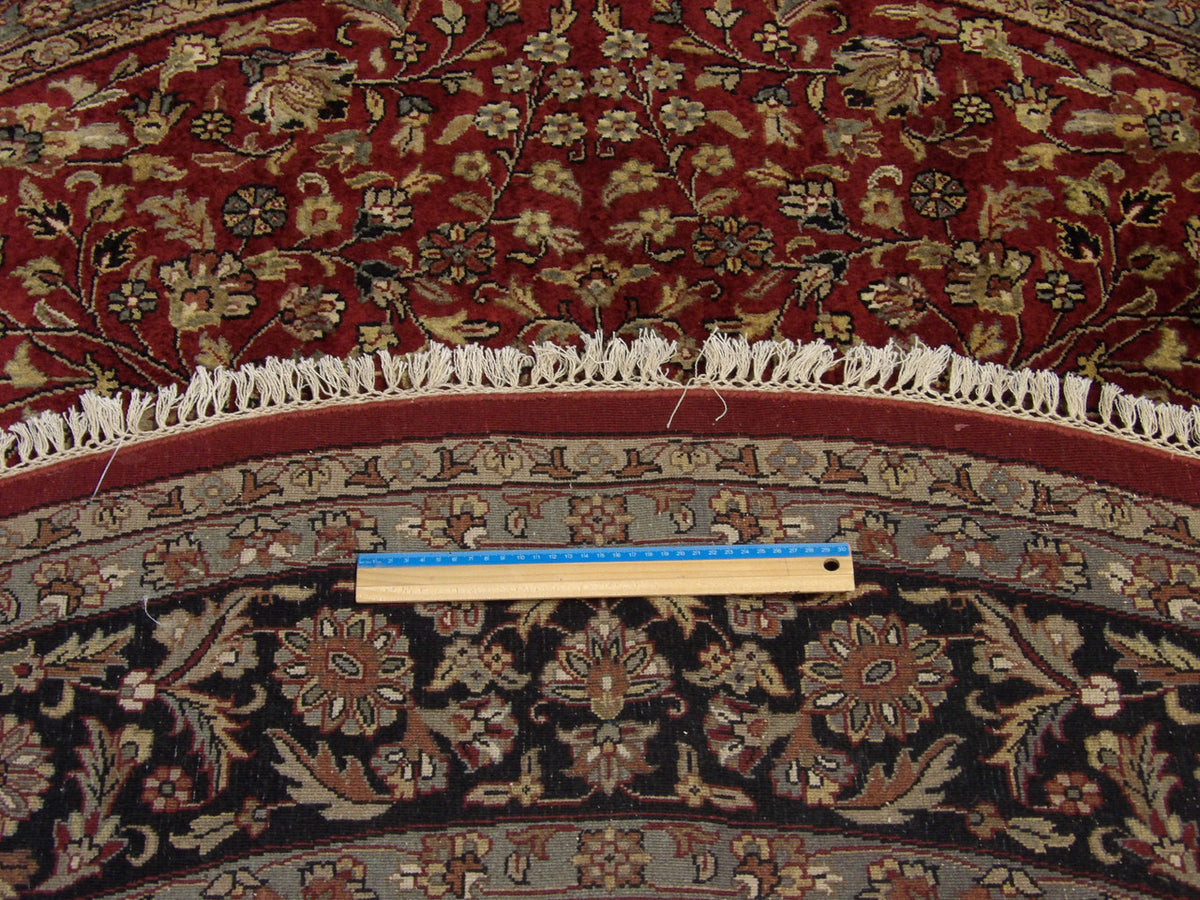 Black & Red Fine Persian Tabriz rug in room setting