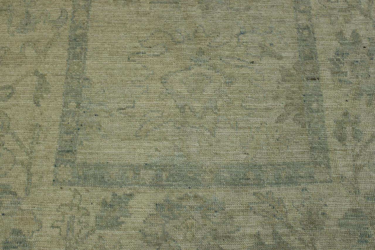 Beige & Pink Oushak Chobi rug in room setting
