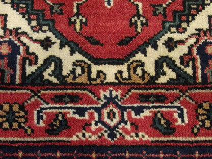 Tribal Heriz rug edge and fringe detail, red