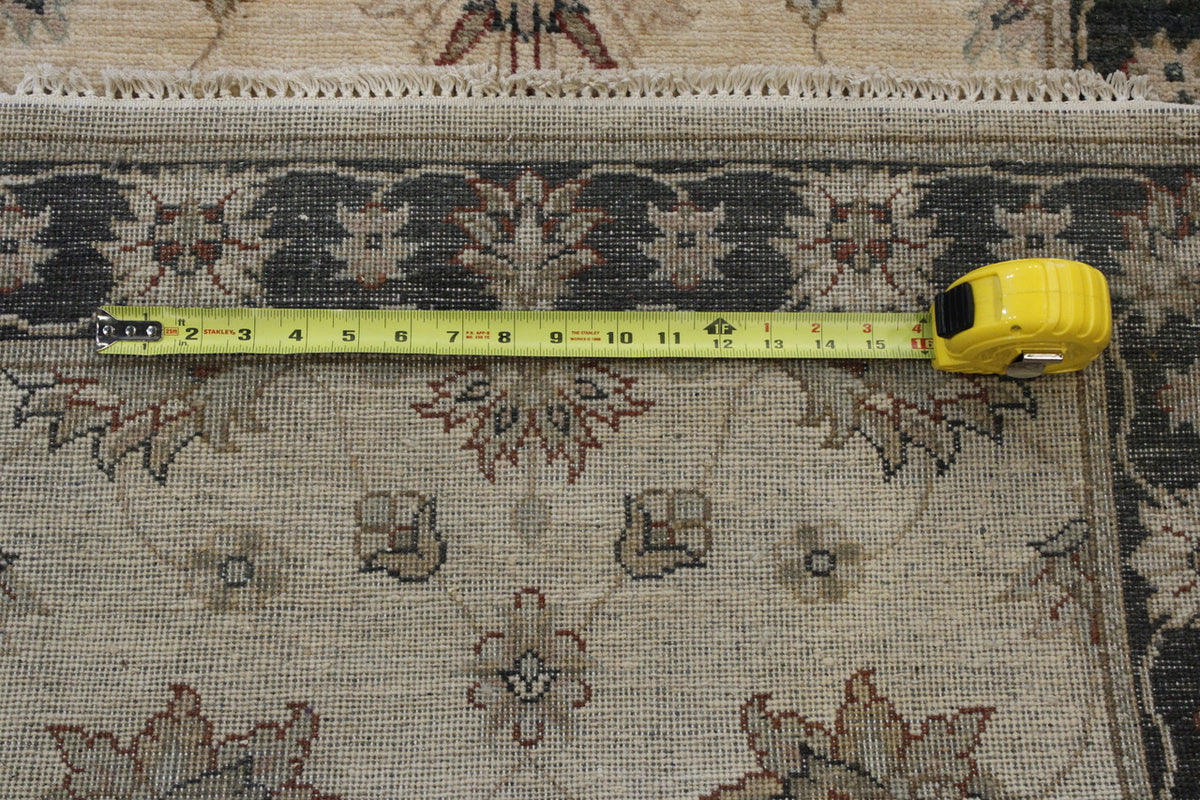 Beige Traditional Indo Ziegler Chobi rug in room setting