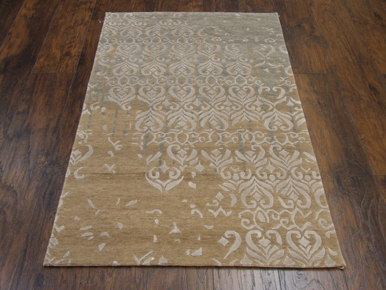 Close-up of wool-silk sheen on modern broken design rug