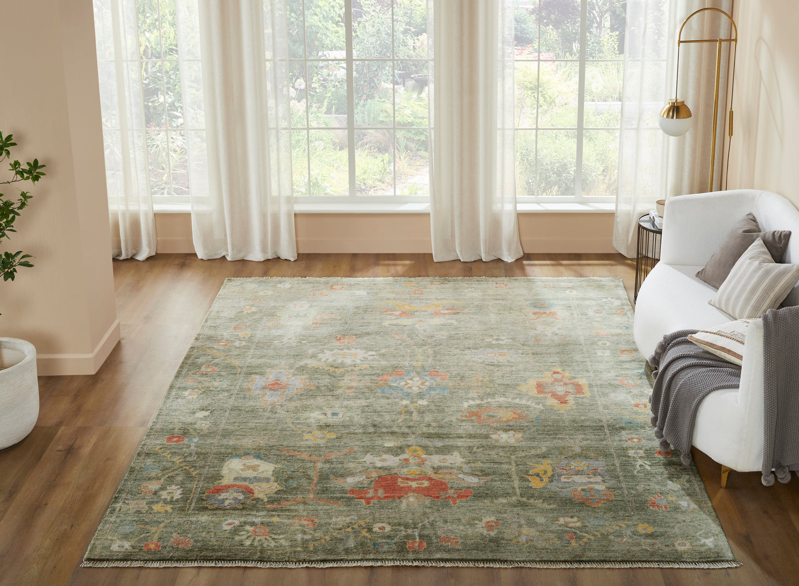 Green transitional wool-silk rug in room setting