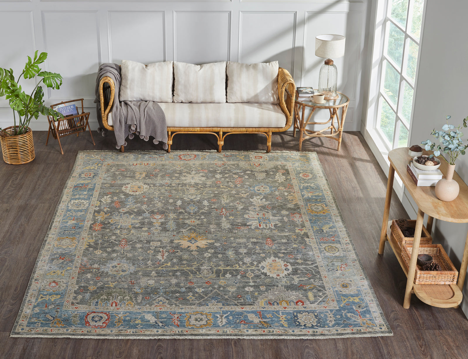 Black and blue transitional wool rug in room setting