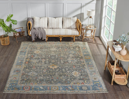 Black and blue transitional wool rug in room setting
