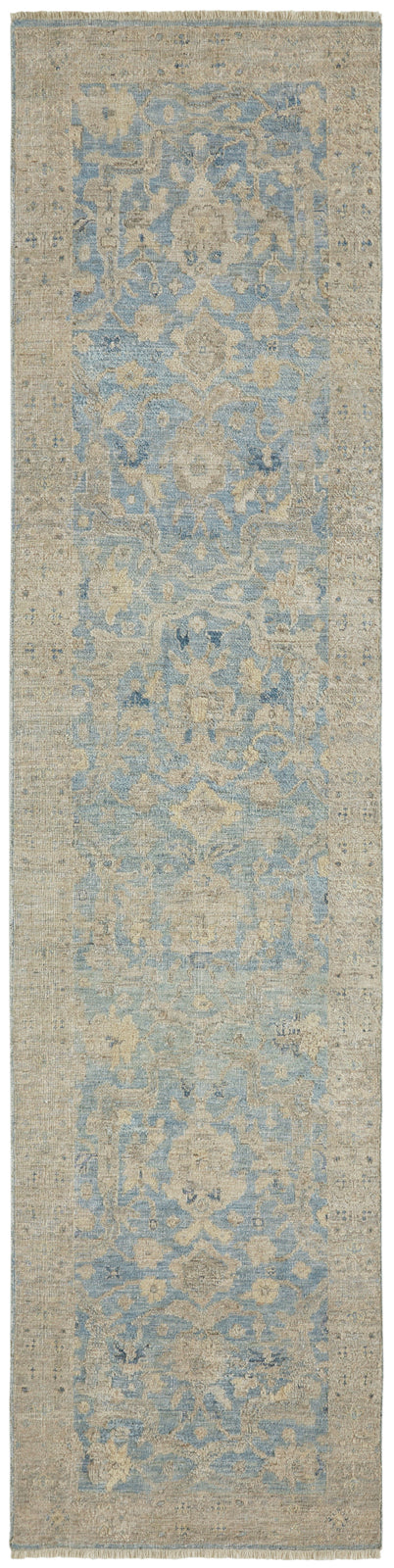Corner detail, transitional wool rug in gray and blue