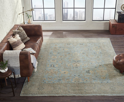 Gray and blue transitional wool rug in room setting