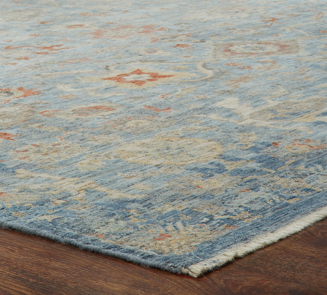 Corner detail, transitional wool rug in blue and gray