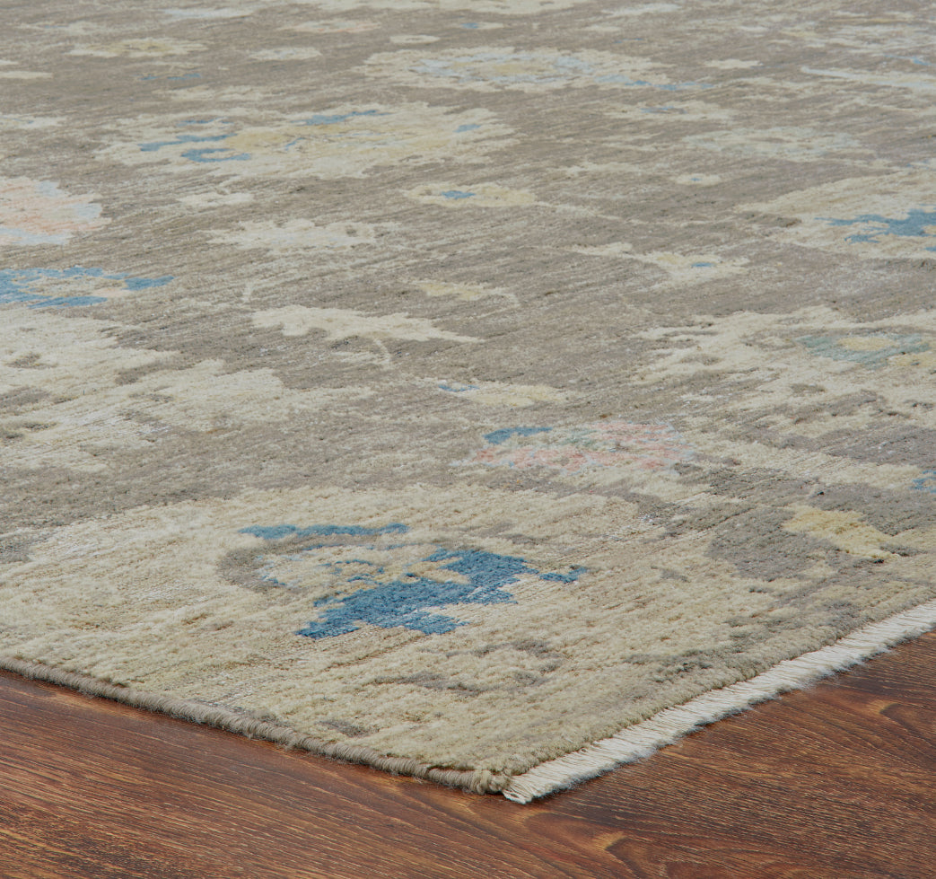 Corner detail, transitional wool rug in gray and beige