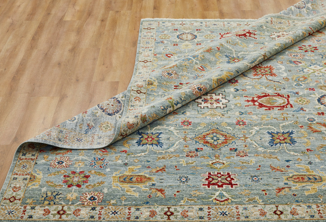 Corner detail, transitional wool rug in blue and beige