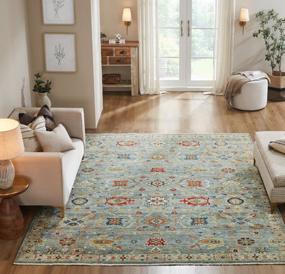 Blue and beige transitional wool rug in room setting