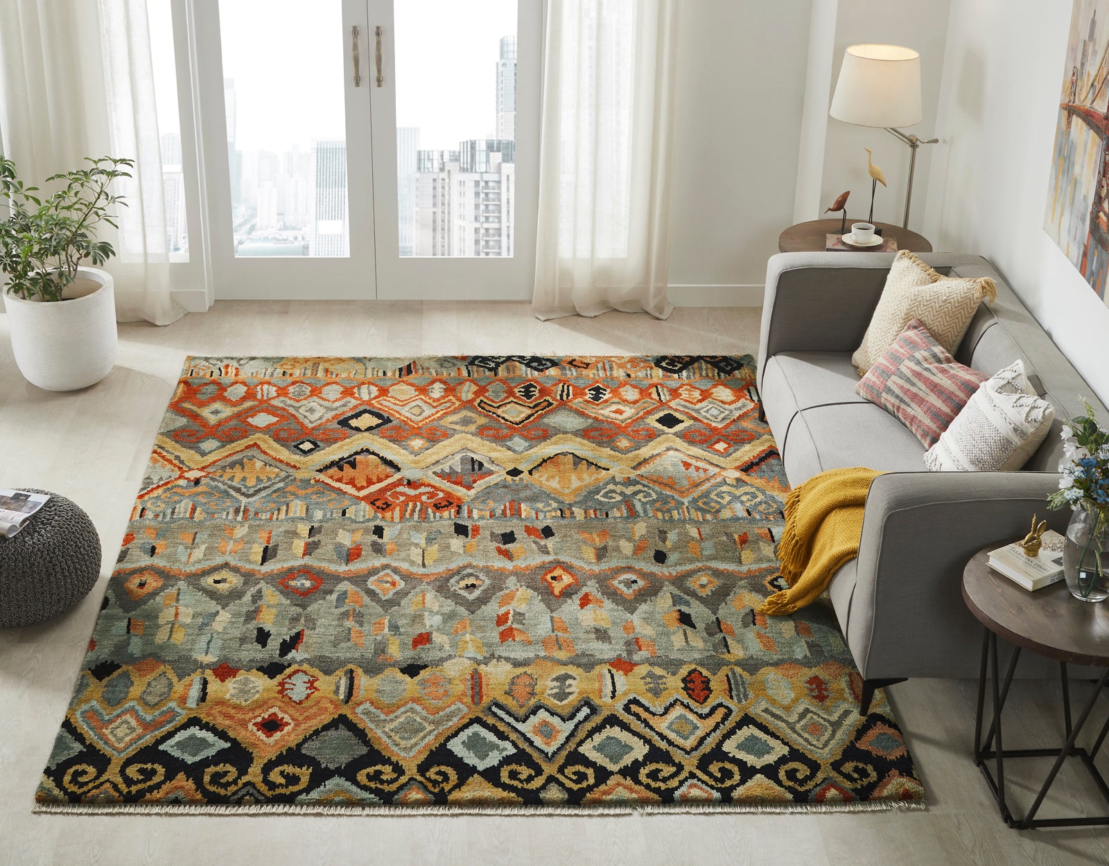Black and rust Ikat wool rug in room setting
