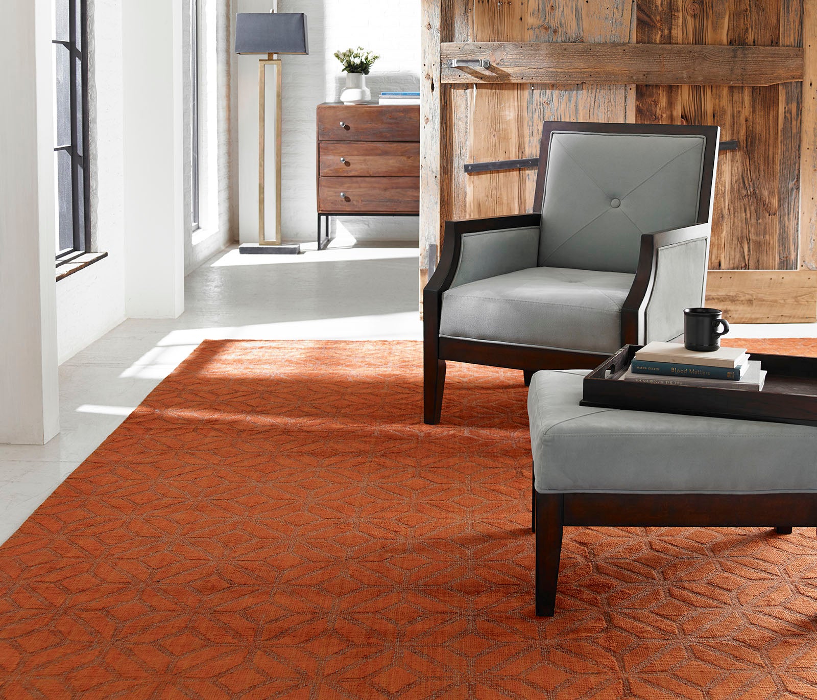 Rust and brown transitional wool-silk rug in room setting