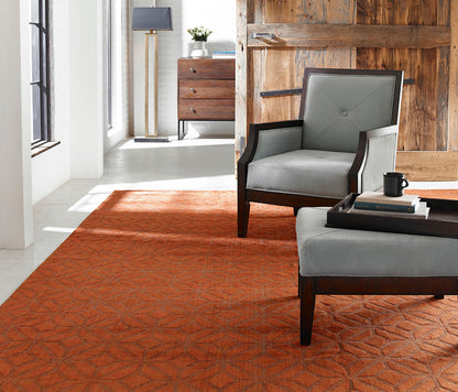 Rust and brown transitional wool-silk rug in room setting