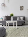 Green and gray modern silk rug in room setting