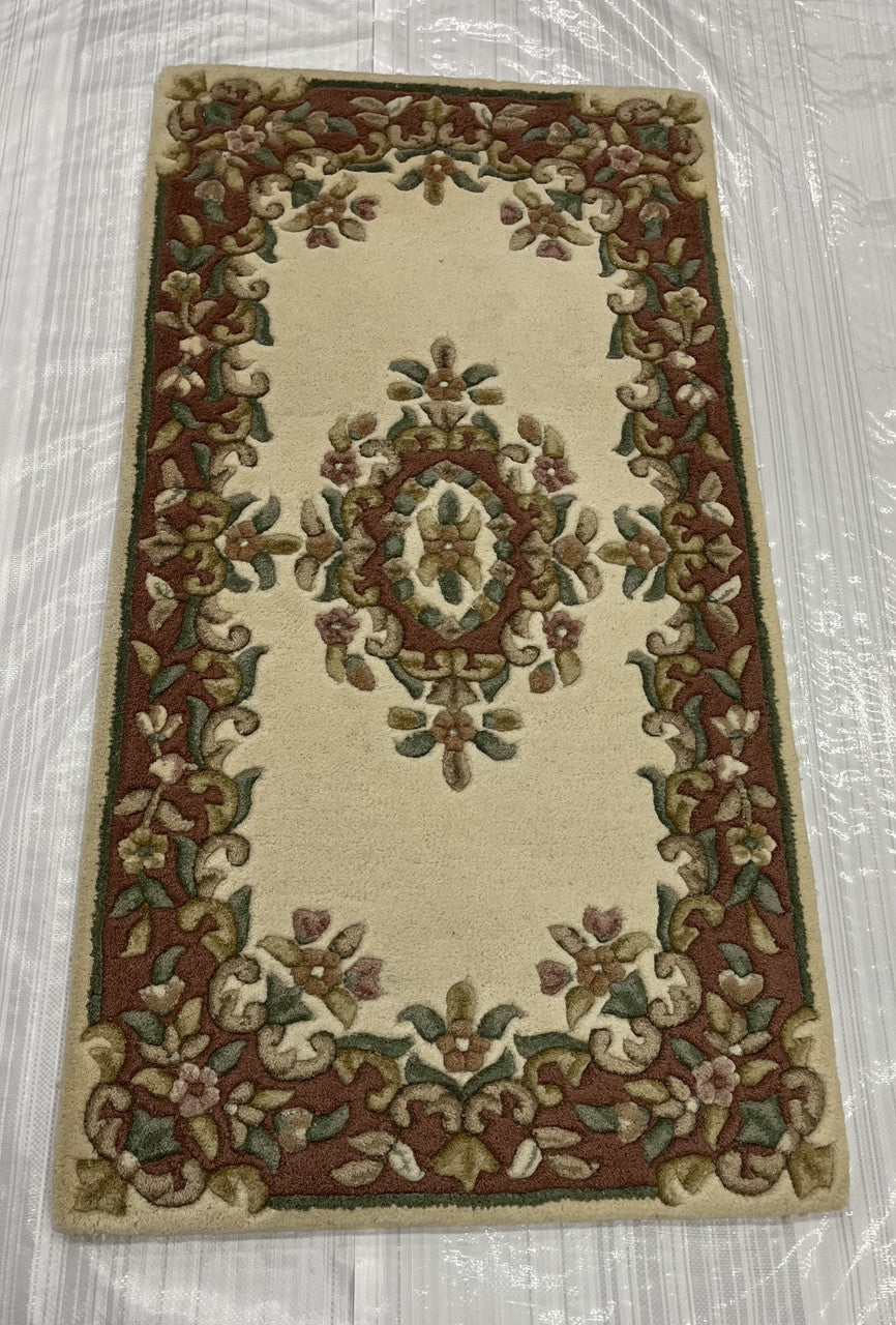 Traditional hand-knotted wool rug in Red, full view