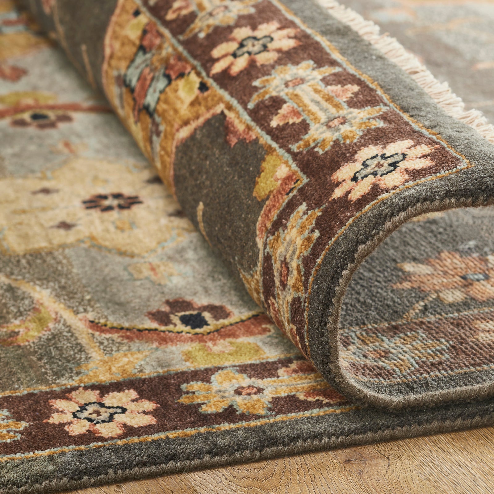 Close-up of wool pile, orange and brown rug