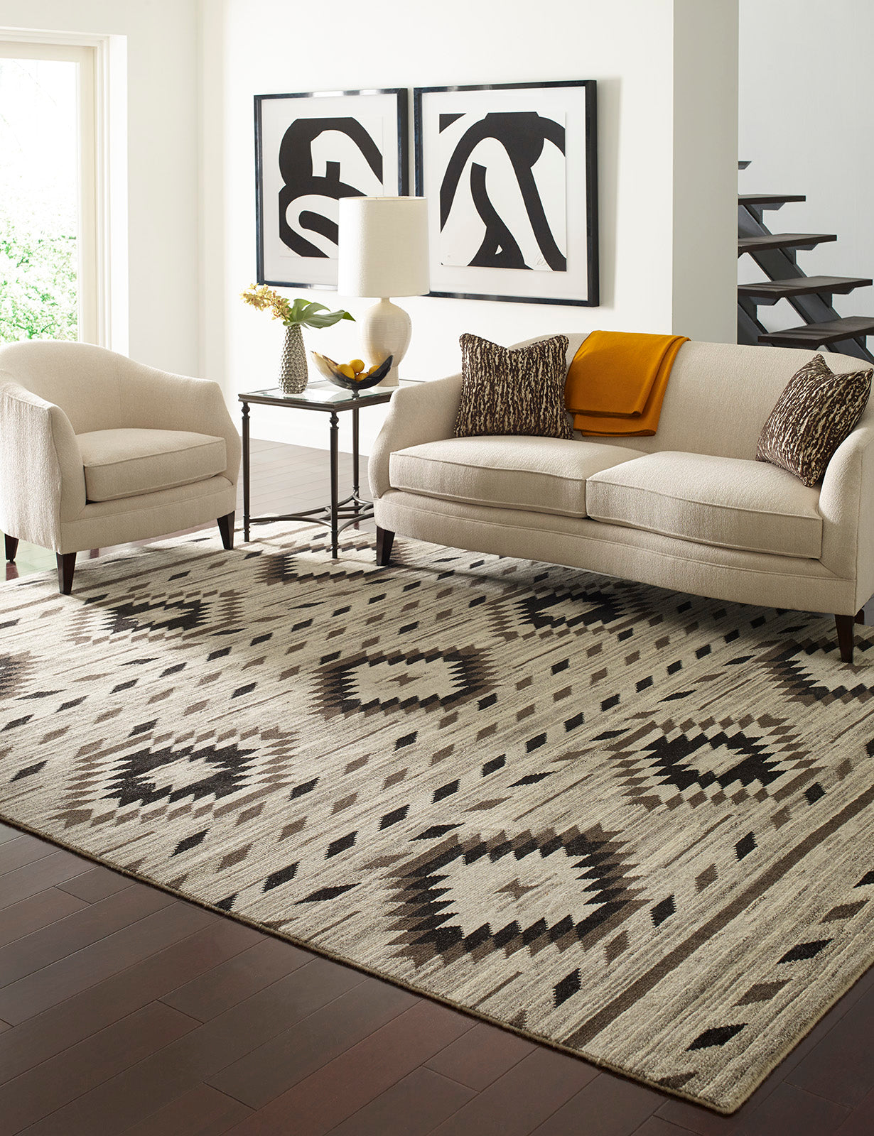 Beige and black wool rug in room setting
