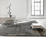 Blue and brown modern wool rug in room setting