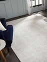Light gray transitional wool-silk rug in room setting