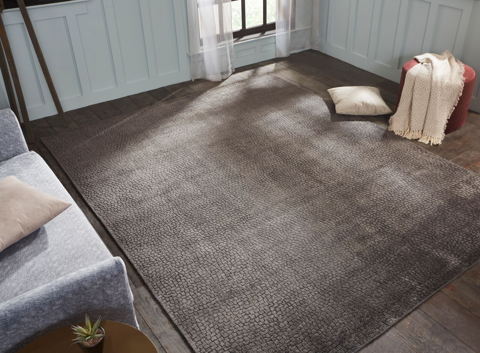 Gray transitional wool-silk rug in room setting