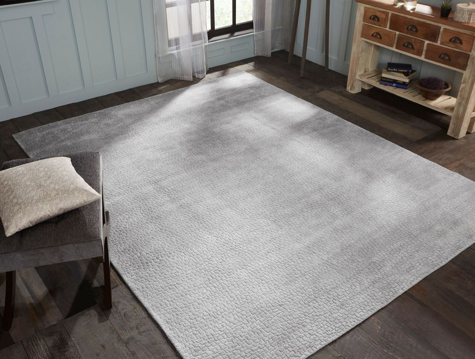 Gray transitional wool-silk rug in room setting