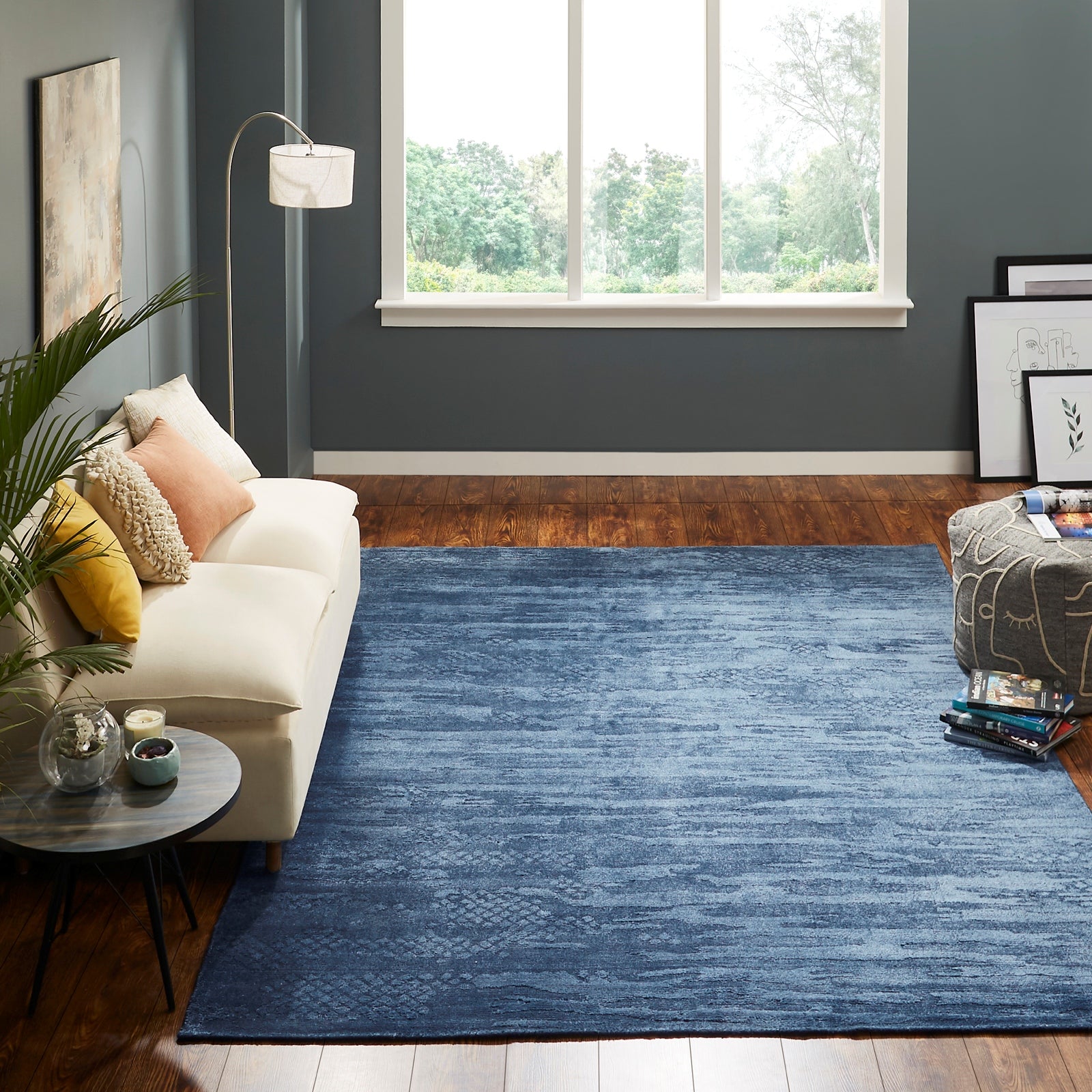 Blue transitional wool-silk rug in room setting