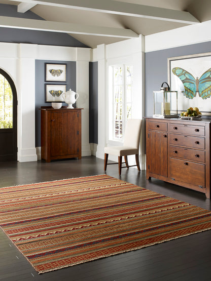 Rust and gold nomadic wool rug in room setting