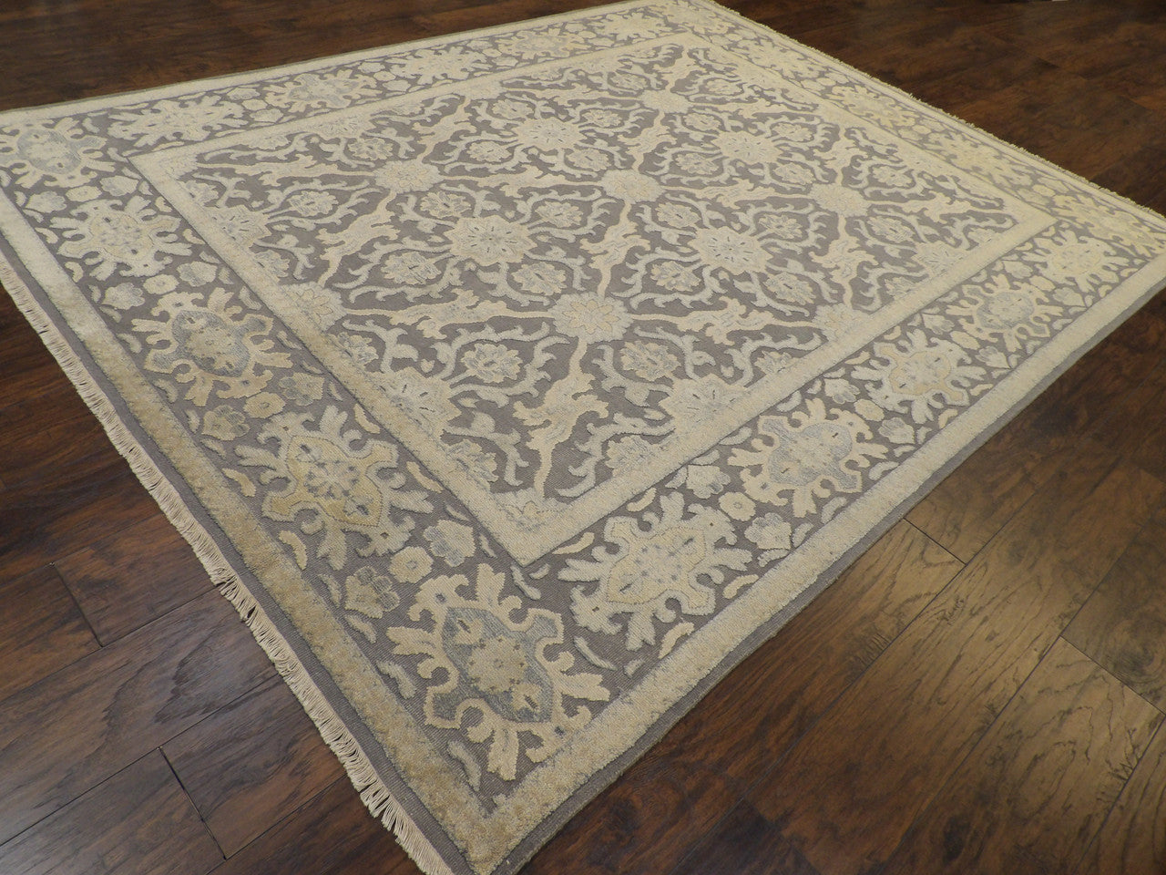 Oushak pattern detail on gray and beige wool-silk rug