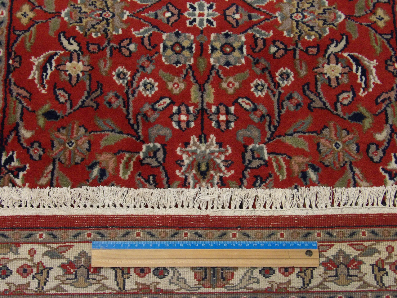 Beige & Red Fine Persian Kashan rug in room setting