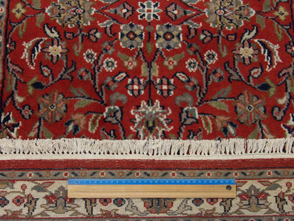 Beige & Red Fine Persian Kashan rug in room setting