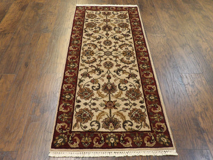 Beige and red Kashan runner in hallway setting