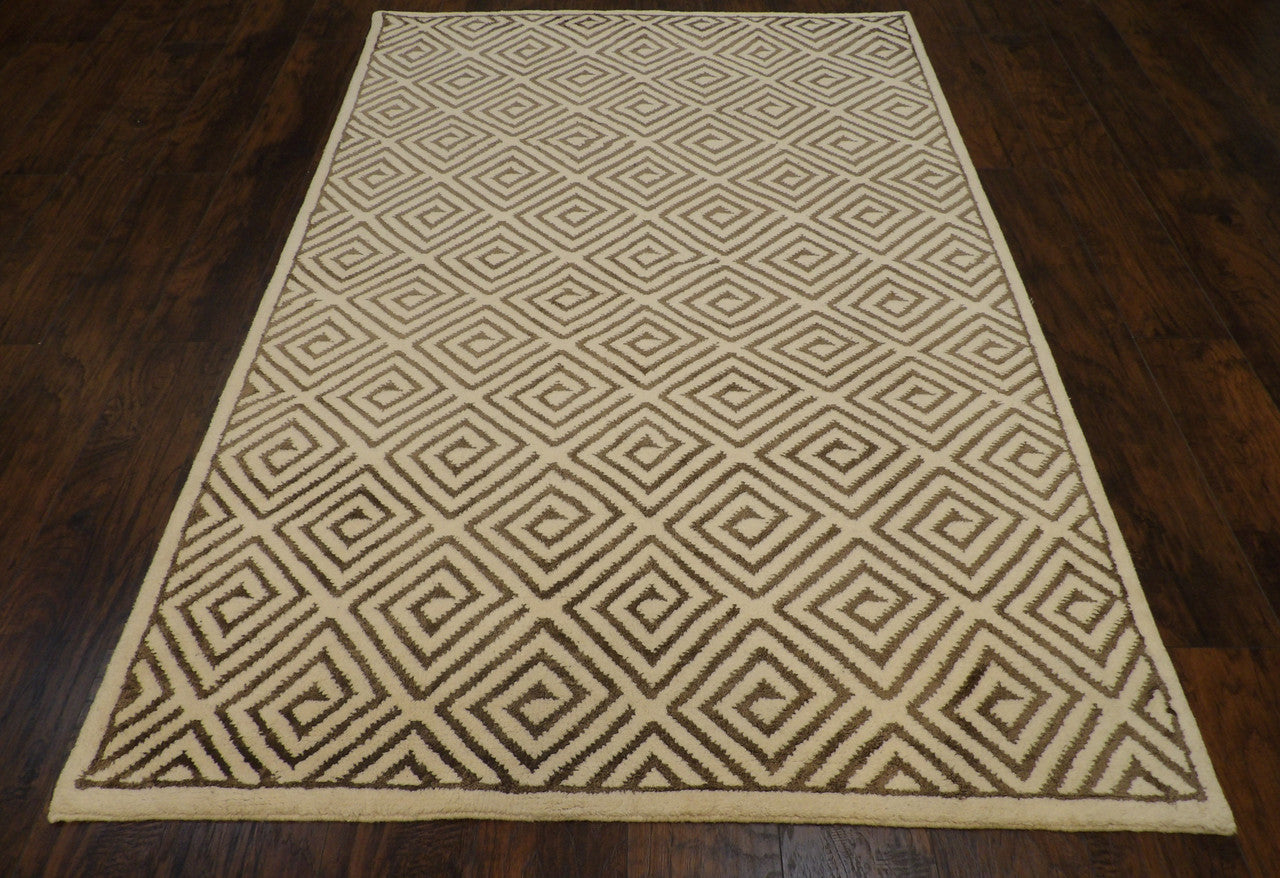 Close-up of wool pile, brown and ivory rug