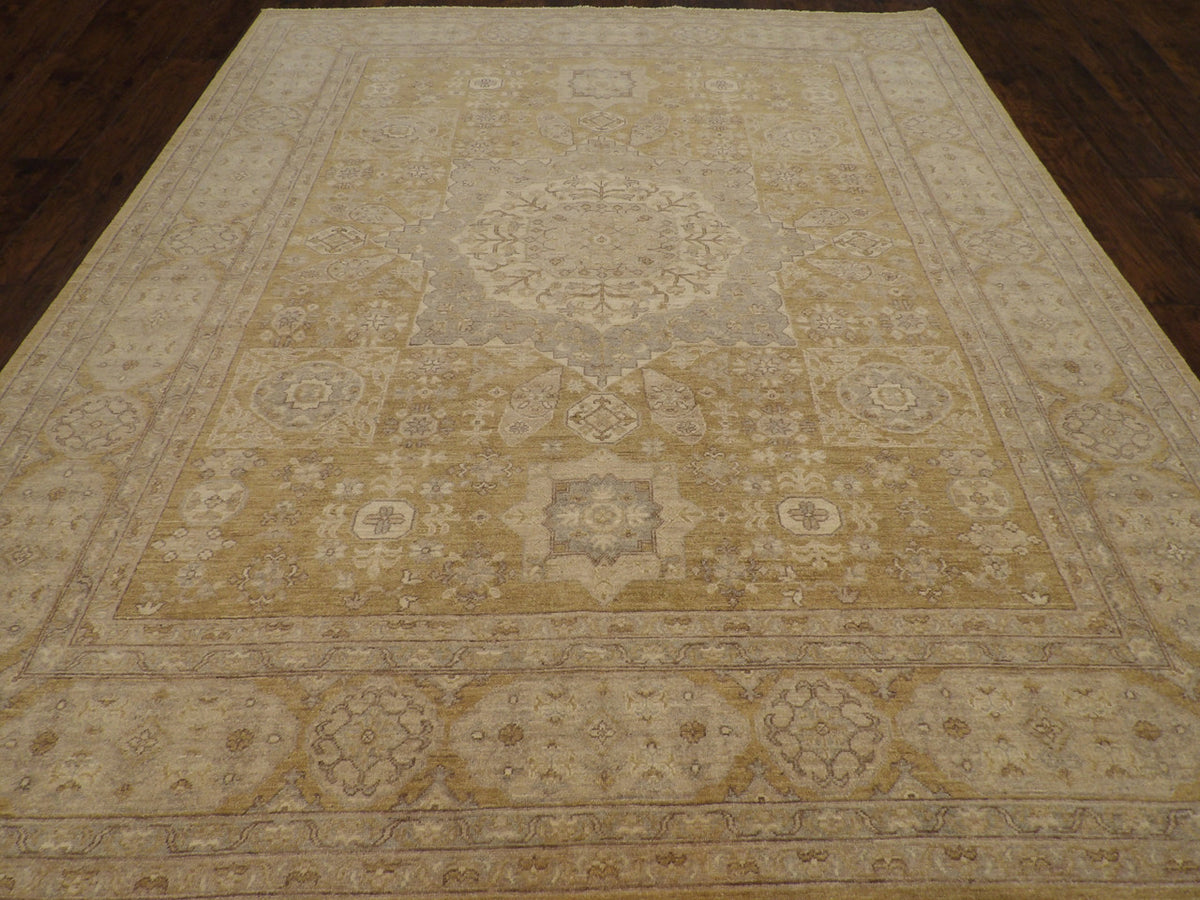 Close-up of wool pile, gold and gray rug