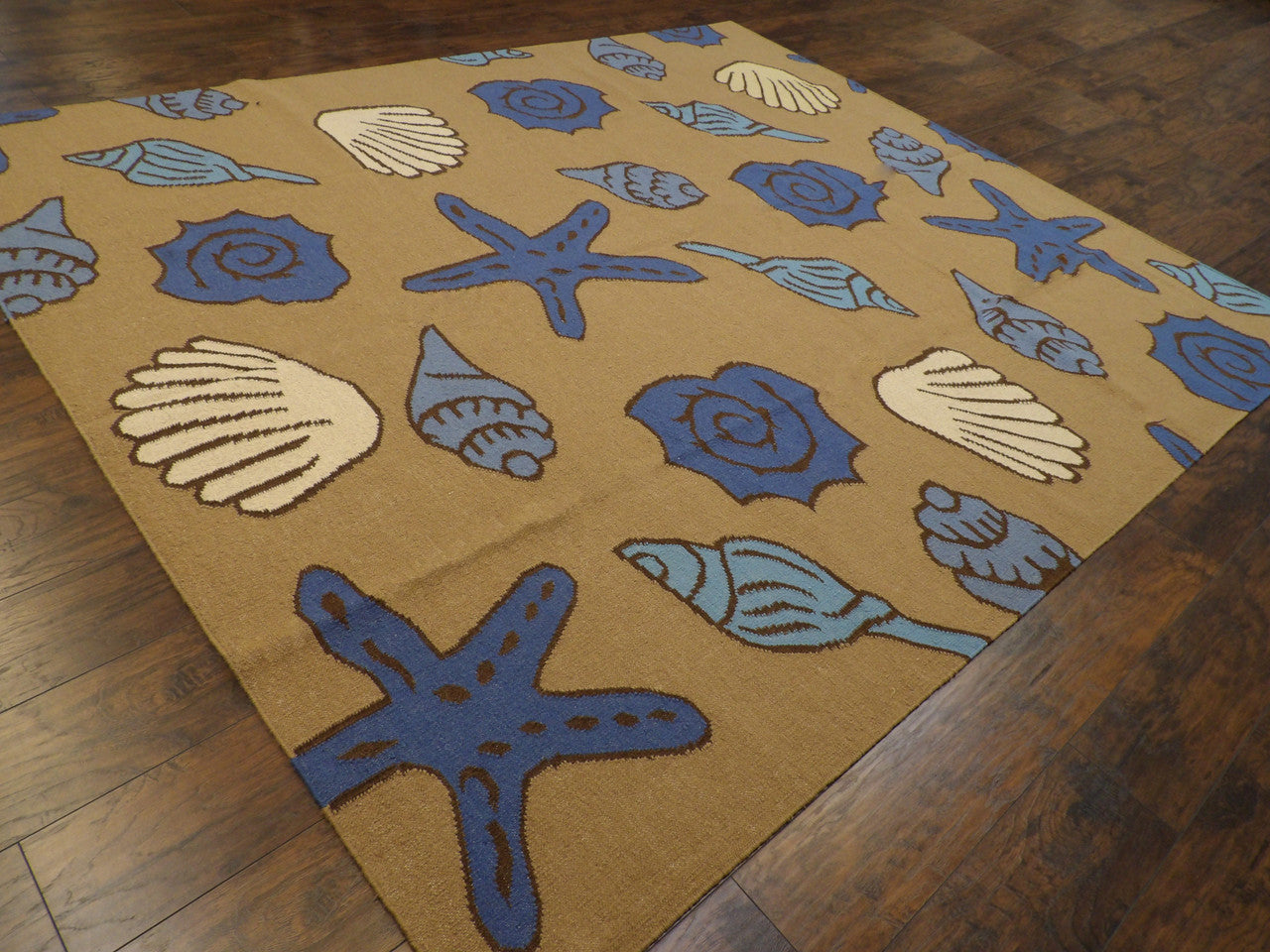 Coastal pattern detail, blue and brown rug
