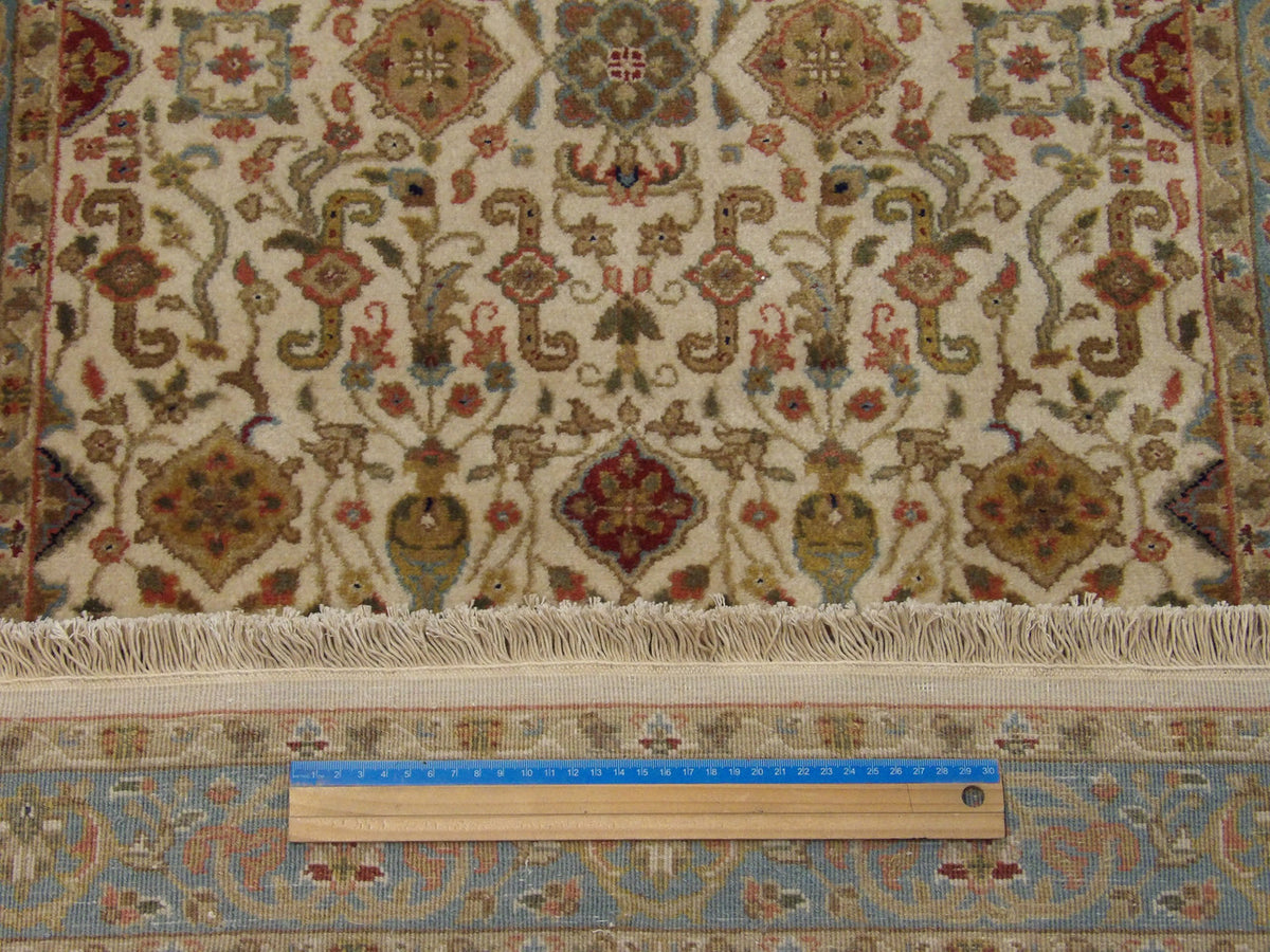 Beige & Teal Fine Persian Kashan rug in room setting