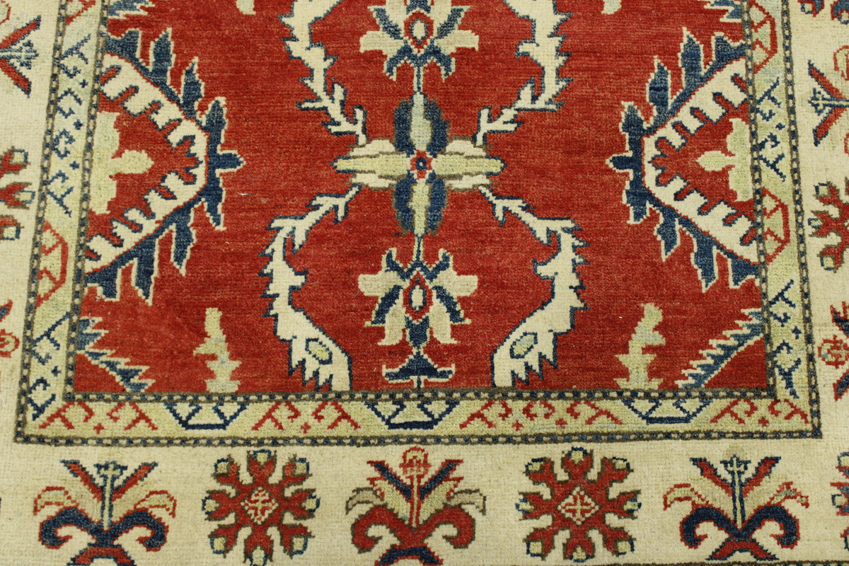 Beige & Red Tribal Super Kazak rug in room setting