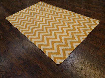 Gold coastal flatweave rug in a sunroom setting