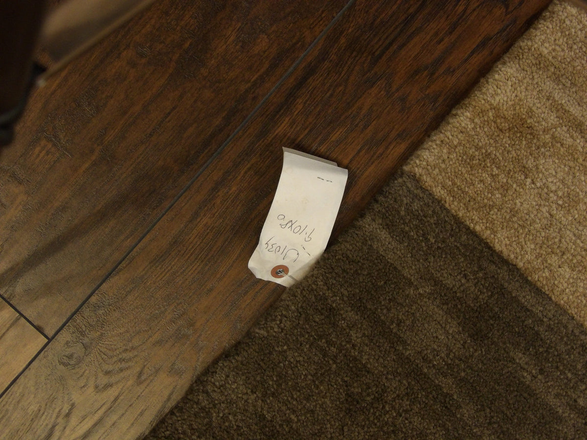 Full room view of modern geometrical hand-knotted rug