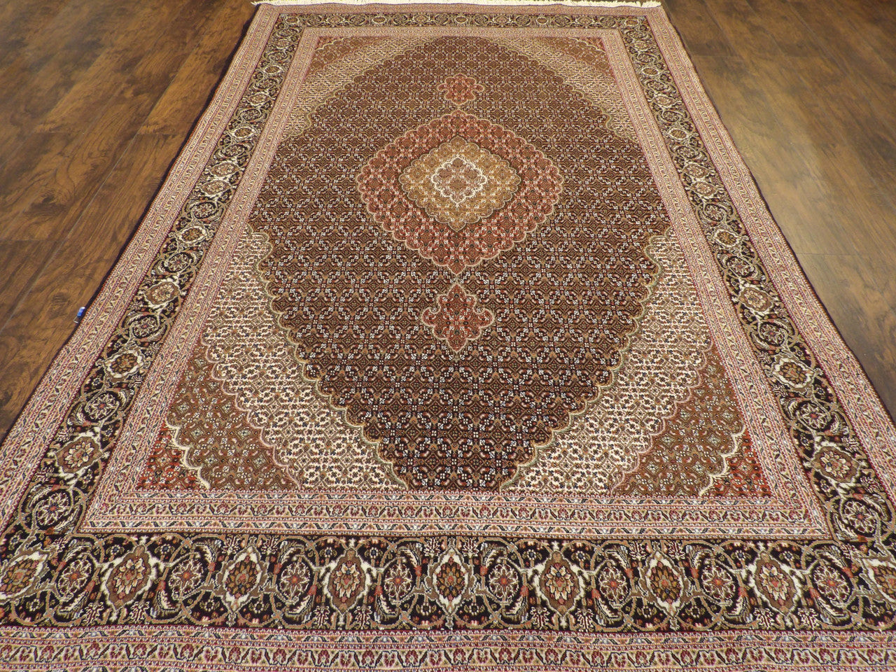 Back of hand-knotted Mahi Tabriz rug showing construction
