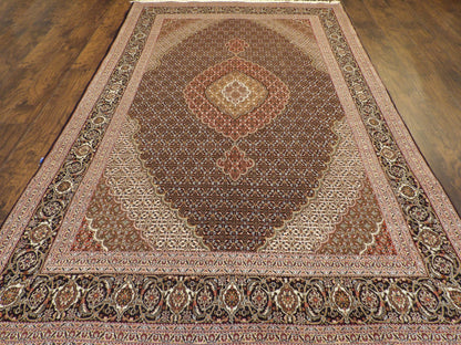 Back of hand-knotted Mahi Tabriz rug showing construction