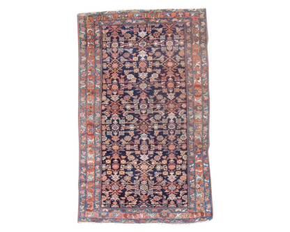 Antique Persian Mir hand-knotted wool rug in blue and rust, full view