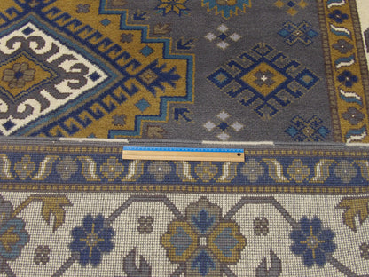 Blue & Beige Tribal Kazak rug in room setting